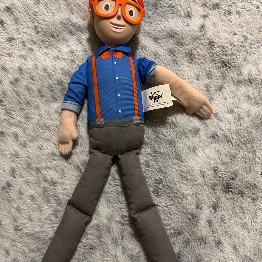 Plush Action Figure with Blue Shirt and Orange Accents